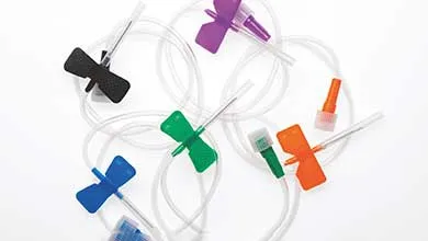 Butterfly needles with black, blue, green, orange, and purple wings scattered on a white background.