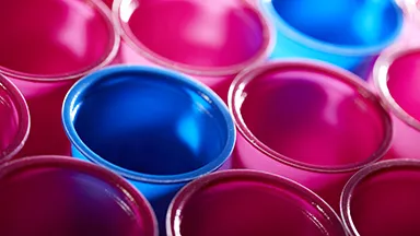 Close up of pink and blue transparent plastic cups